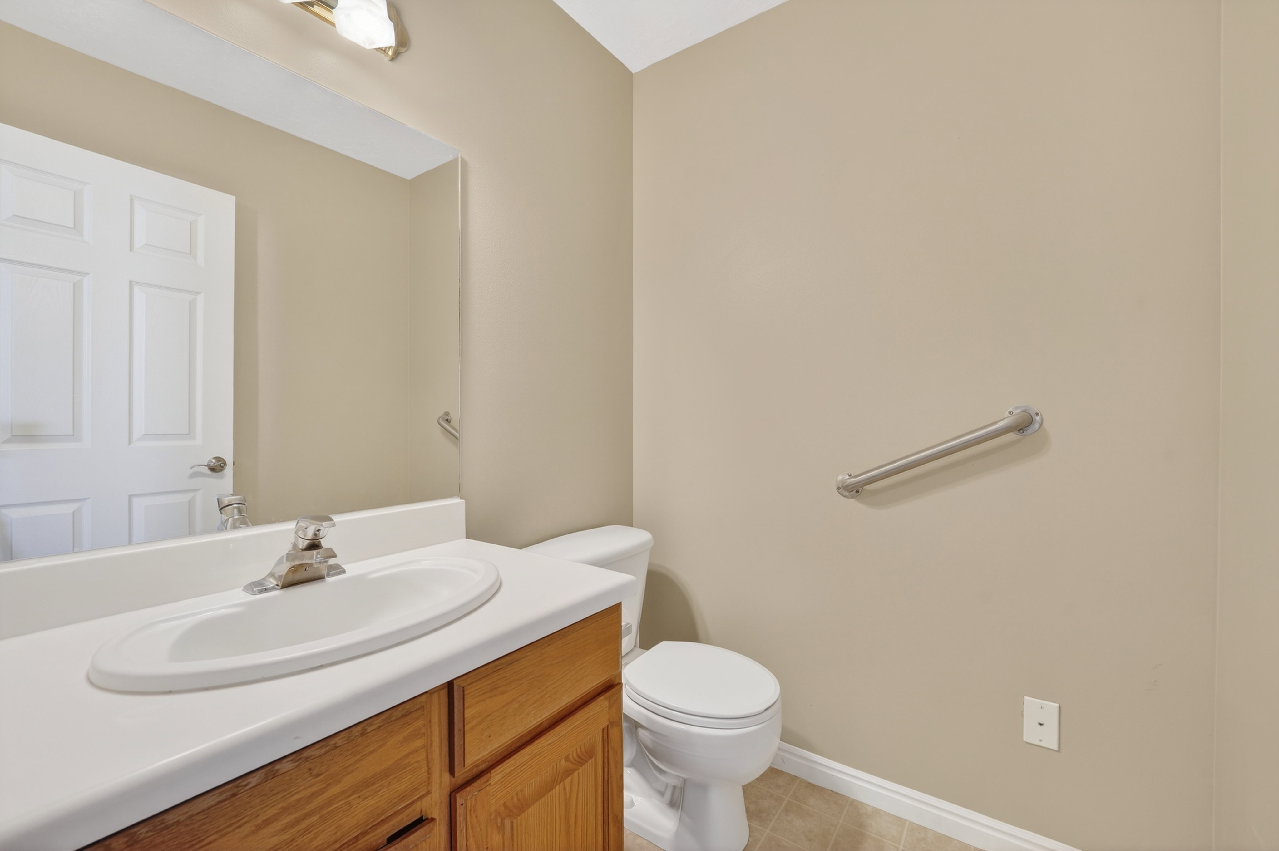 Bathroom with vanity and light tile patterned flooring