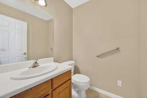 Bathroom with vanity and light tile patterned flooring