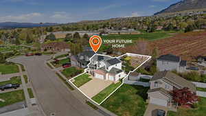 Aerial perspective of suburban area with property boundaries highlighted and a mountainous background