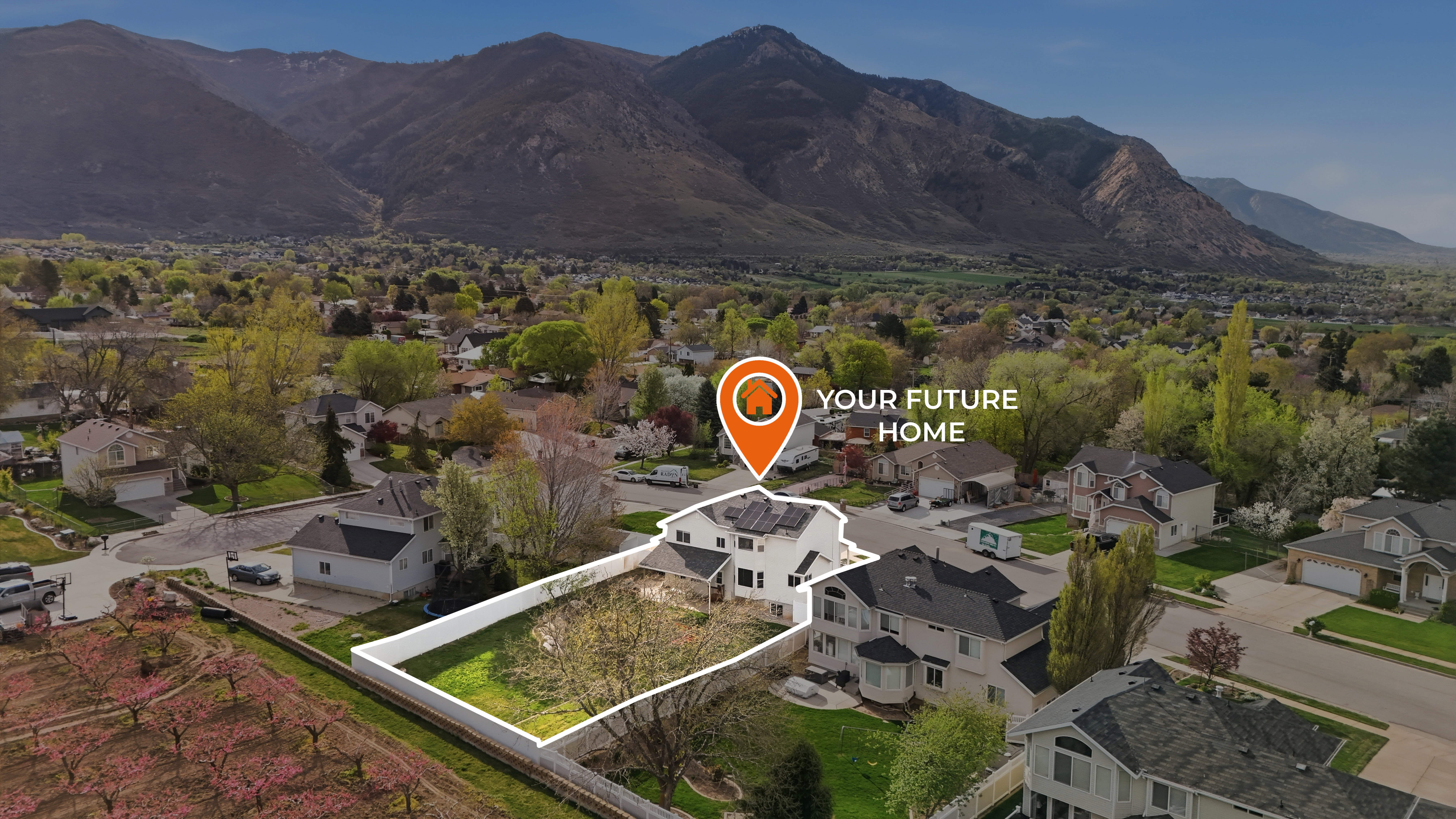 Aerial view of residential area featuring a mountain backdrop