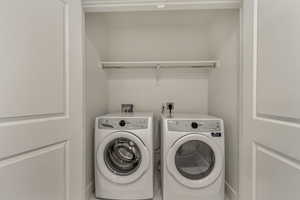 Laundry area featuring independent washer and dryer