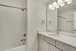 Full bath featuring vanity and shower / bath combination