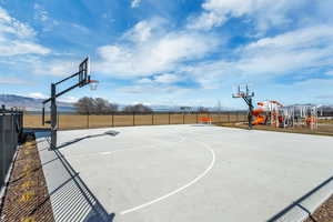 View of basketball court with community basketball court and a mountain view
