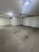 Garage featuring a garage door opener