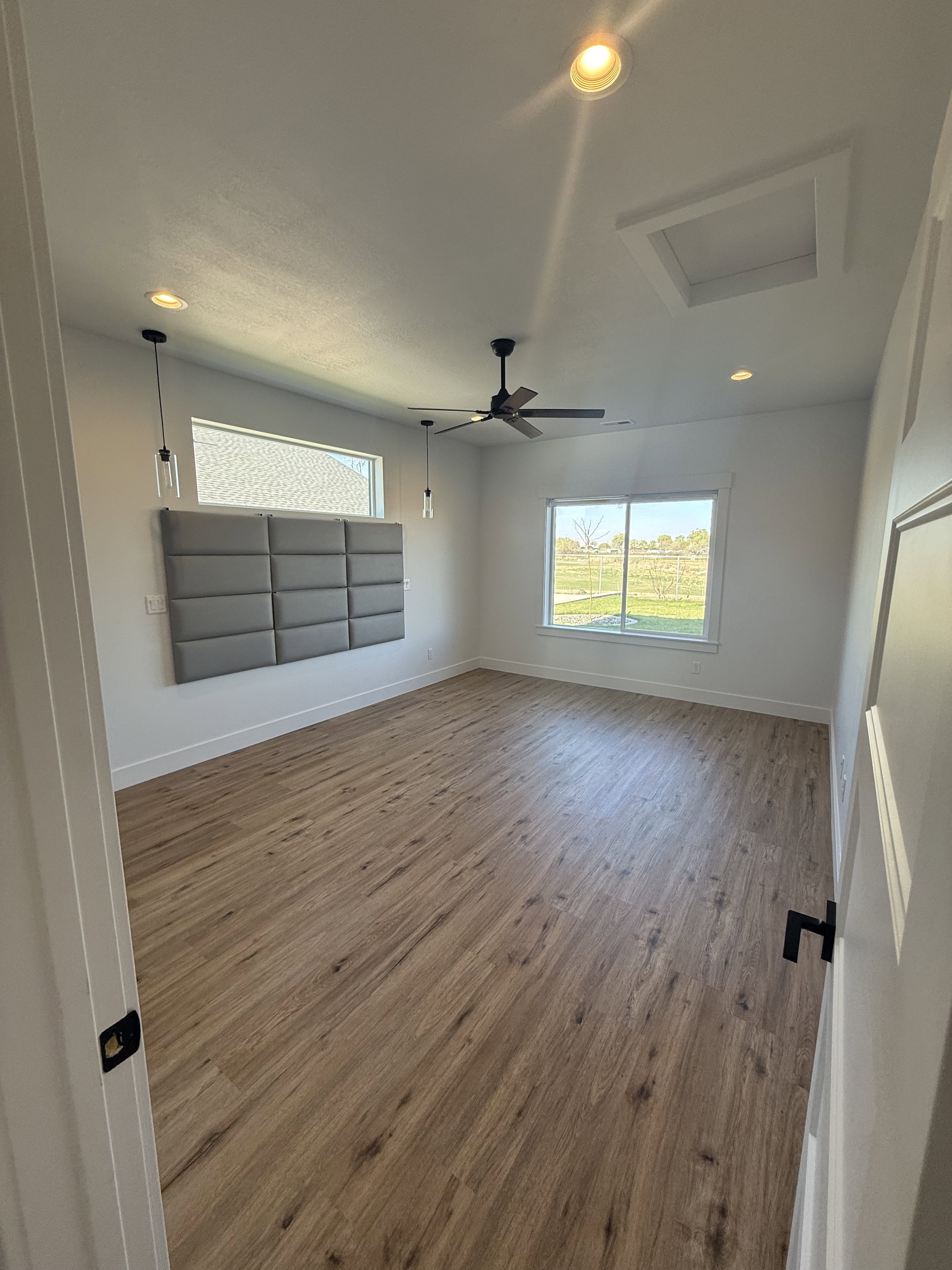 Empty room featuring wood finished floors, recessed lighting, and a ceiling fan