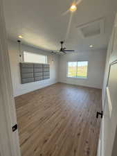 Empty room featuring wood finished floors, recessed lighting, and a ceiling fan