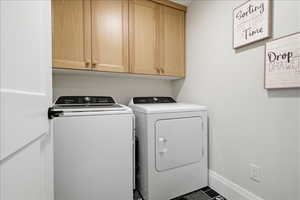 2nd Laundry room with washer and clothes dryer and cabinet space