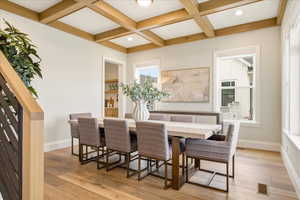 Dining room with coffered ceiling and doorway to kitchen