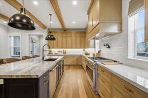 Kitchen with stainless steel appliances, double dishwashers, pot filler, monogram double oven, 6 burner stove, pebble ice machine, custom hood vent