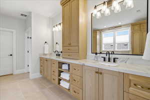 Primary Bathroom with double vanity, light tile patterned floors, and recessed lighting