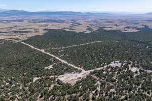 Aerial overview of property's location with a mountainous background