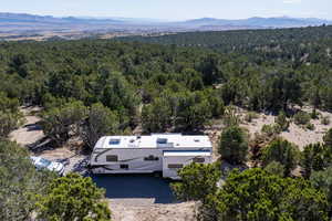 View from above of property with a mountain backdrop