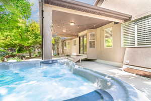 View of swimming pool featuring patio surround and a pool