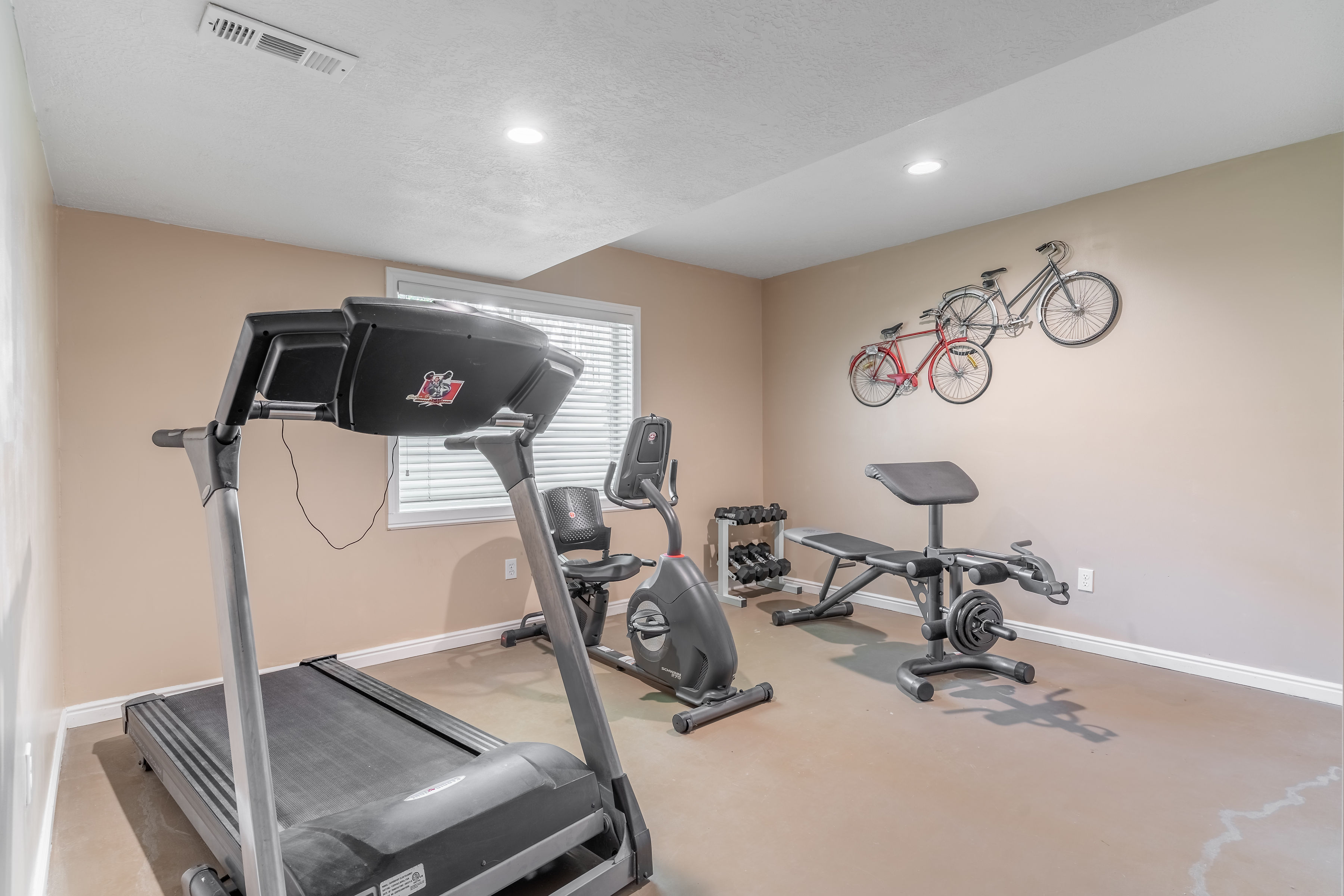Workout area with baseboards and recessed lighting