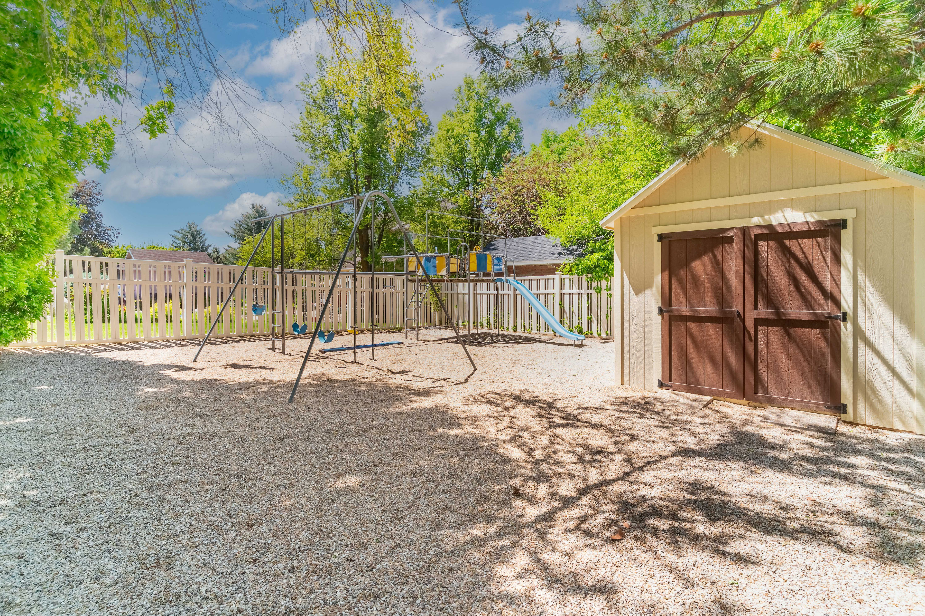 View of play area featuring a storage shed