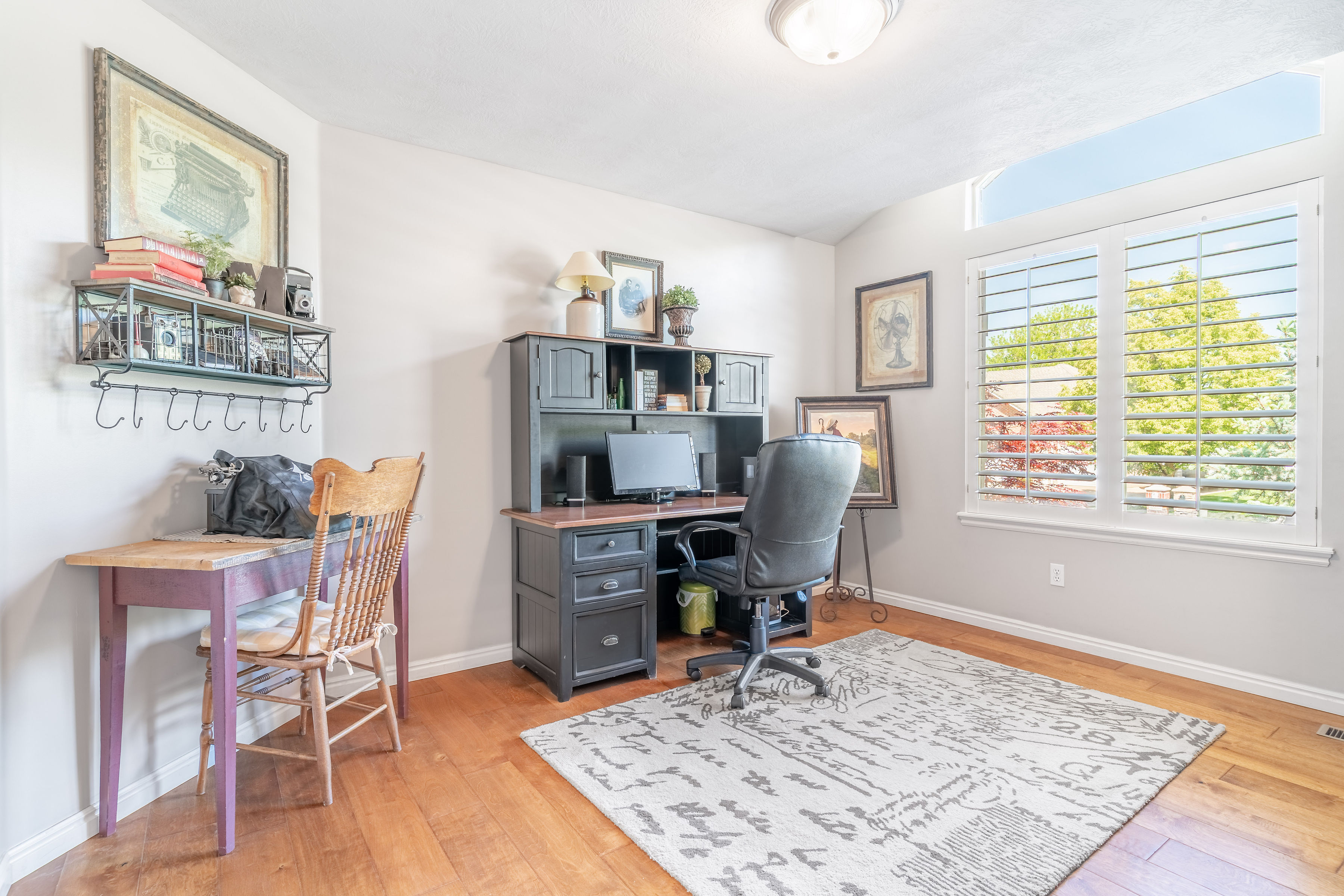 Office area with light wood-style flooring
