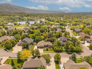 Aerial view of residential area featuring a water and mountain view