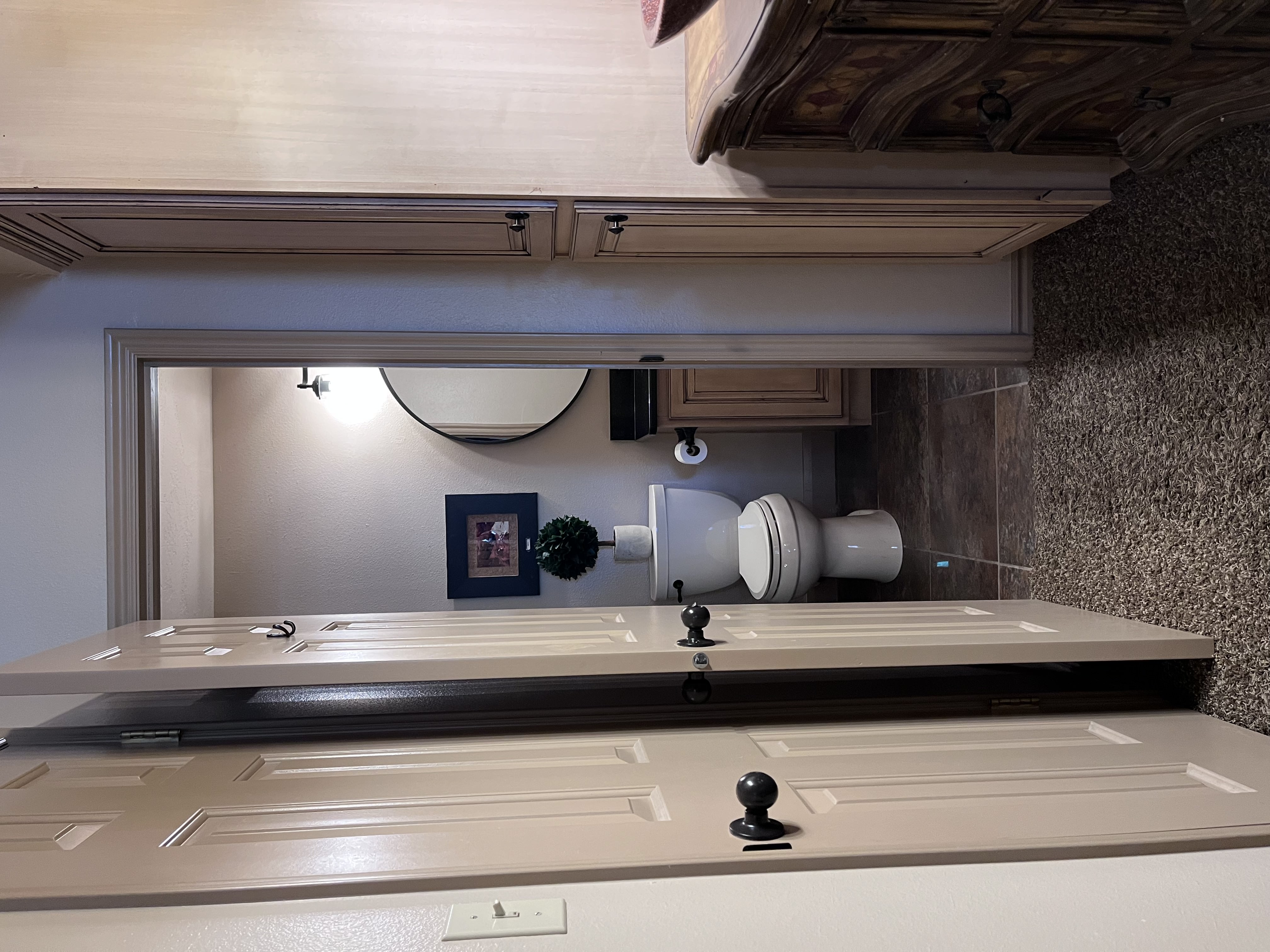 Half bathroom with vanity and toilet