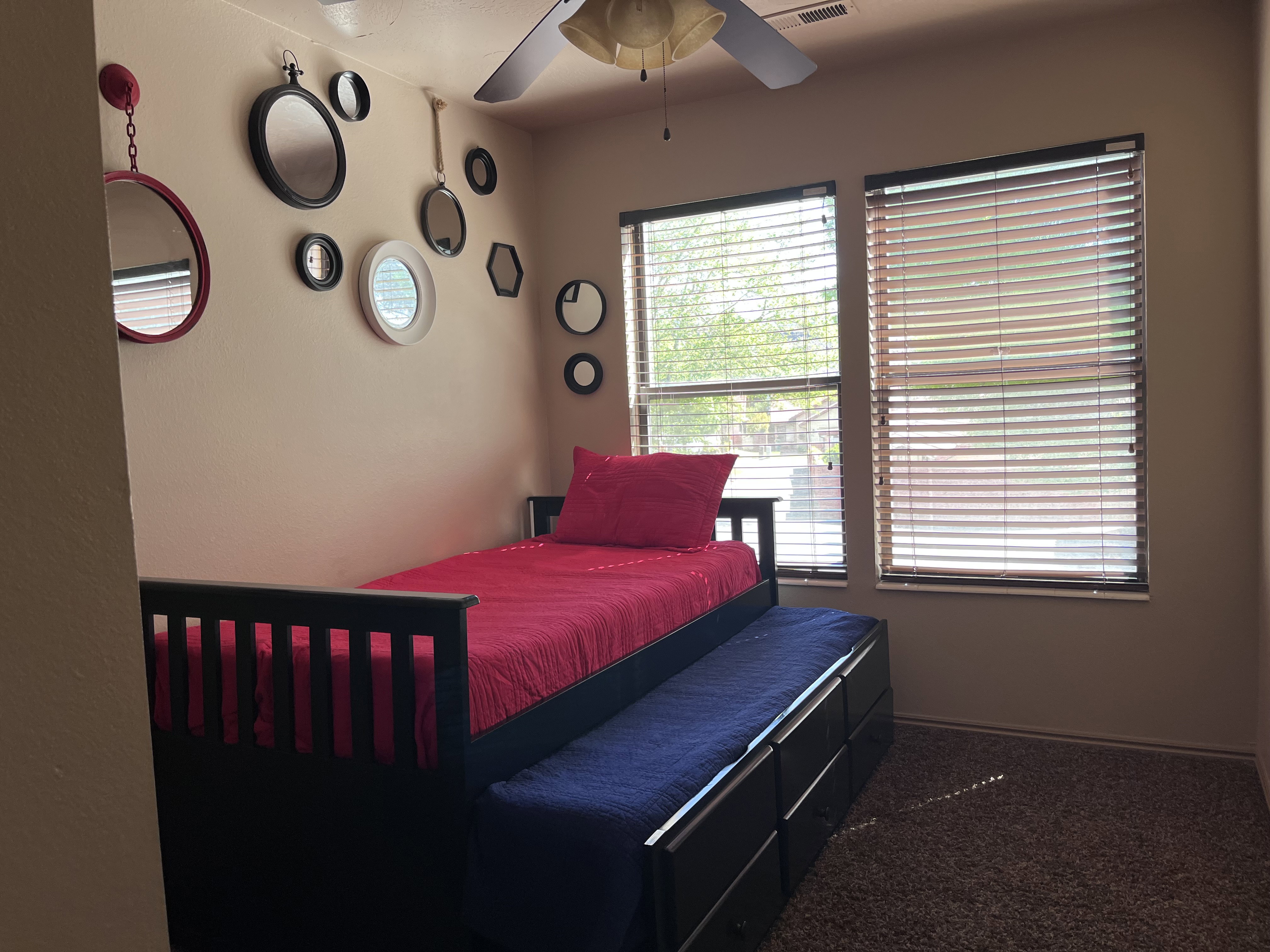 Bedroom featuring carpet and ceiling fan