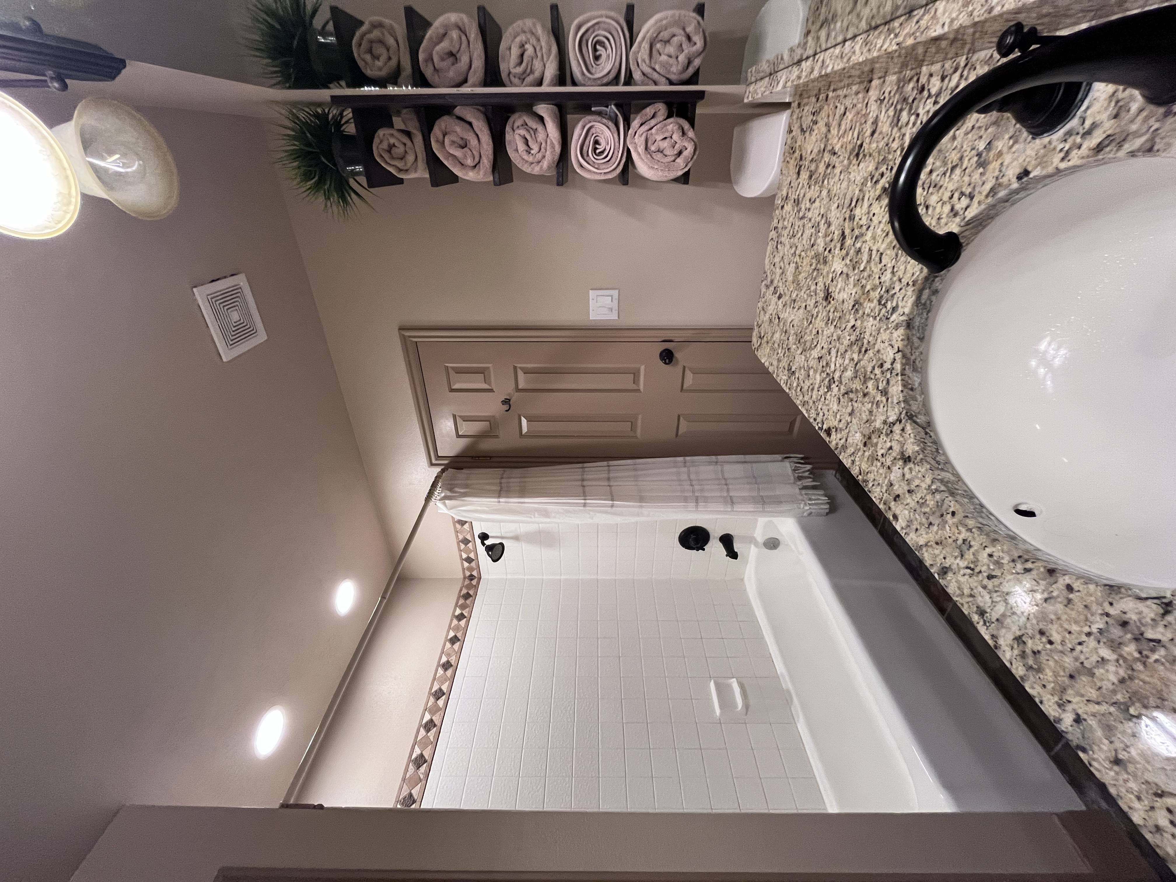 Full bathroom featuring vanity and shower / tub combo