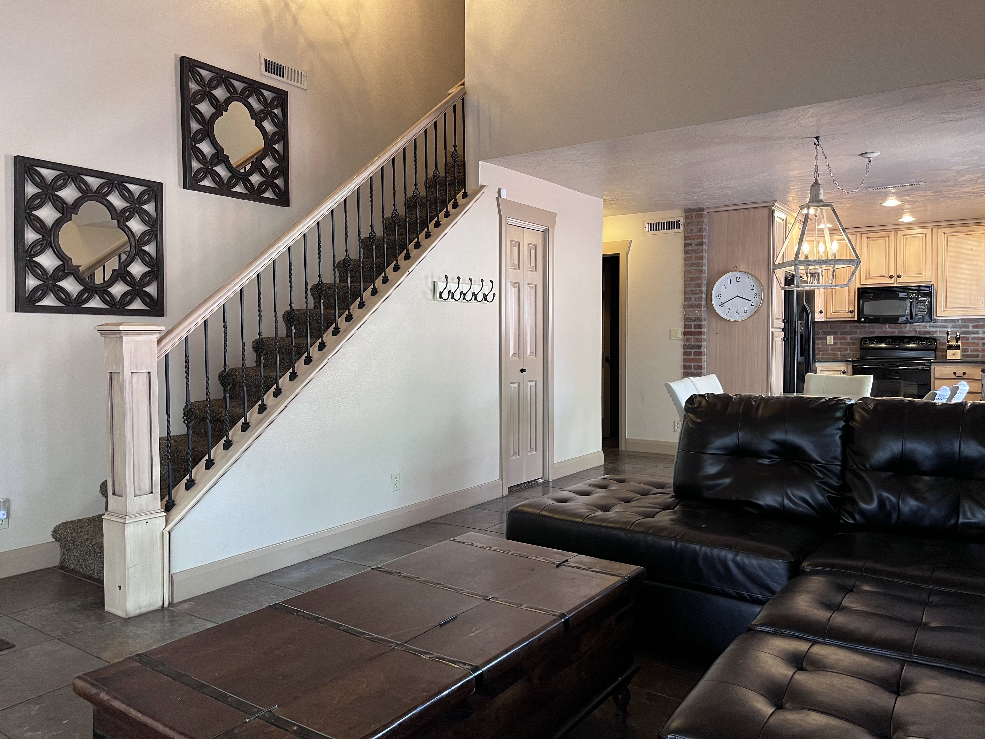 Living area featuring baseboards and stairway