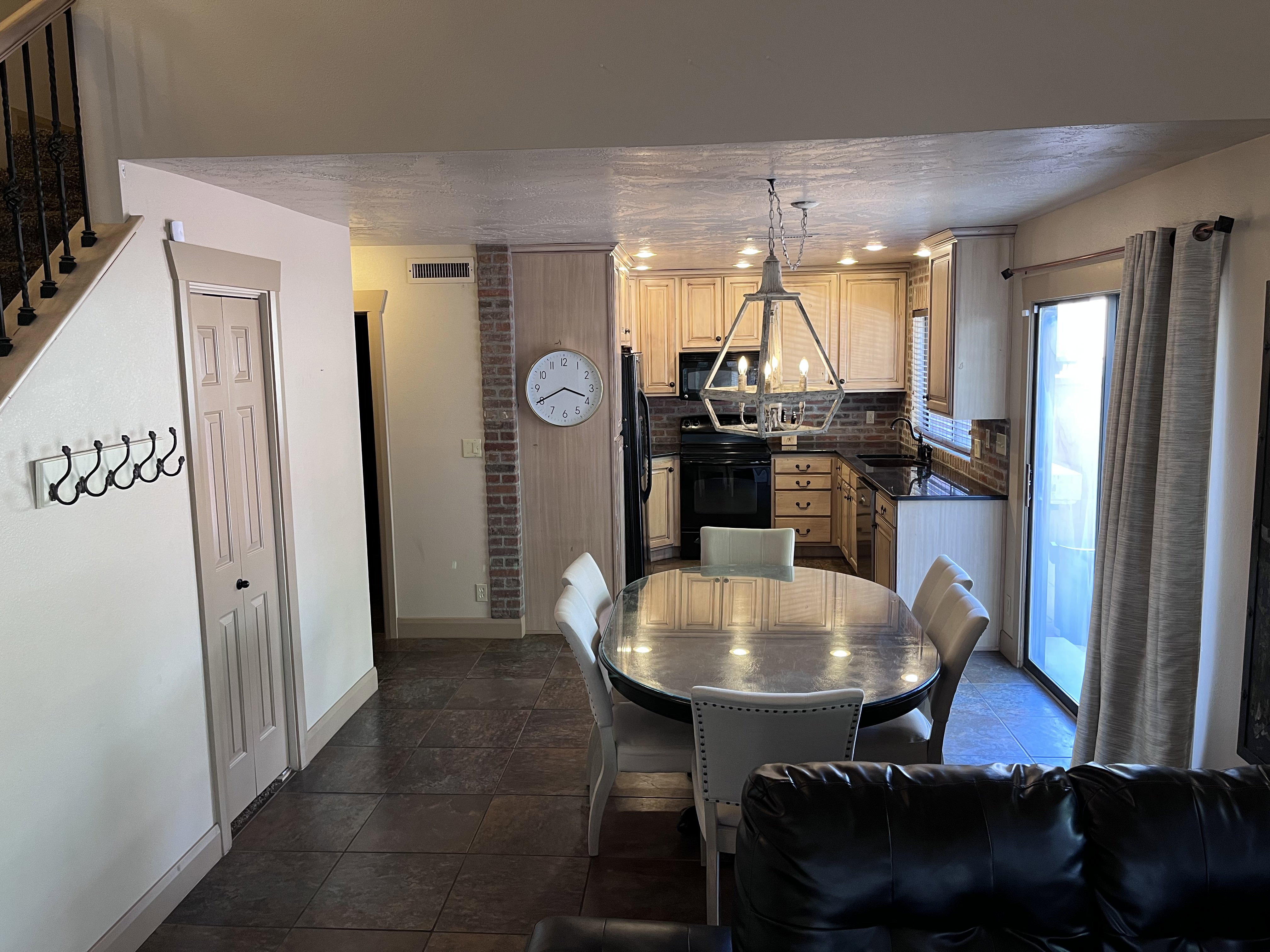Dining space featuring stone tile floors and a textured ceiling
