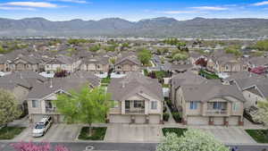 Aerial perspective of suburban area with a mountainous background