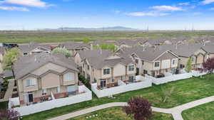 Aerial view of residential area featuring a mountainous background