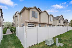 View of side of property with stucco siding and a residential view