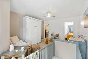 Bedroom with a closet and ceiling fan