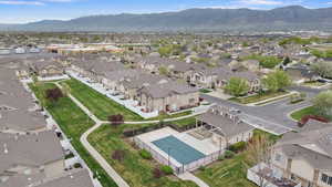 Aerial perspective of suburban area featuring a mountain backdrop