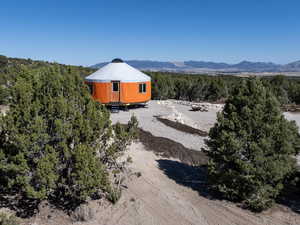 Aerial view of a mountainous background and a heavily wooded area