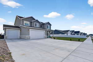 four car garage and extra long driveway with rv or trailer parking on the side