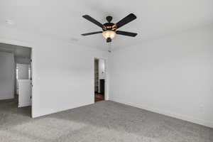 Unfurnished bedroom with carpet and ceiling fan
