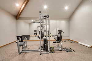 Workout room featuring lofted ceiling with beams, carpet, and recessed lighting