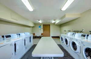 On site shared laundry featuring washer and dryer
