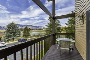 Wooden deck featuring a mountain view