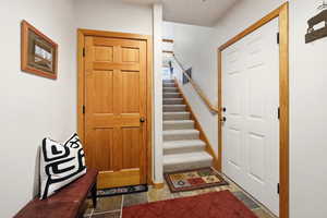 Entrance foyer featuring stairway