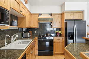 Kitchen with black appliances, open shelves, tile counters, backsplash, and light wood finish cabinetry