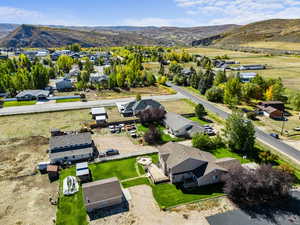 Aerial perspective of suburban area featuring a mountain backdrop