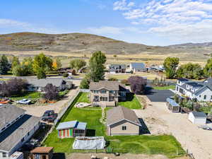 Aerial perspective of suburban area featuring a mountain backdrop