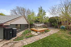 Fenced backyard with a deck