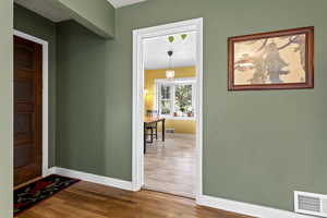 Entrance foyer featuring a textured ceiling and light wood finished floors