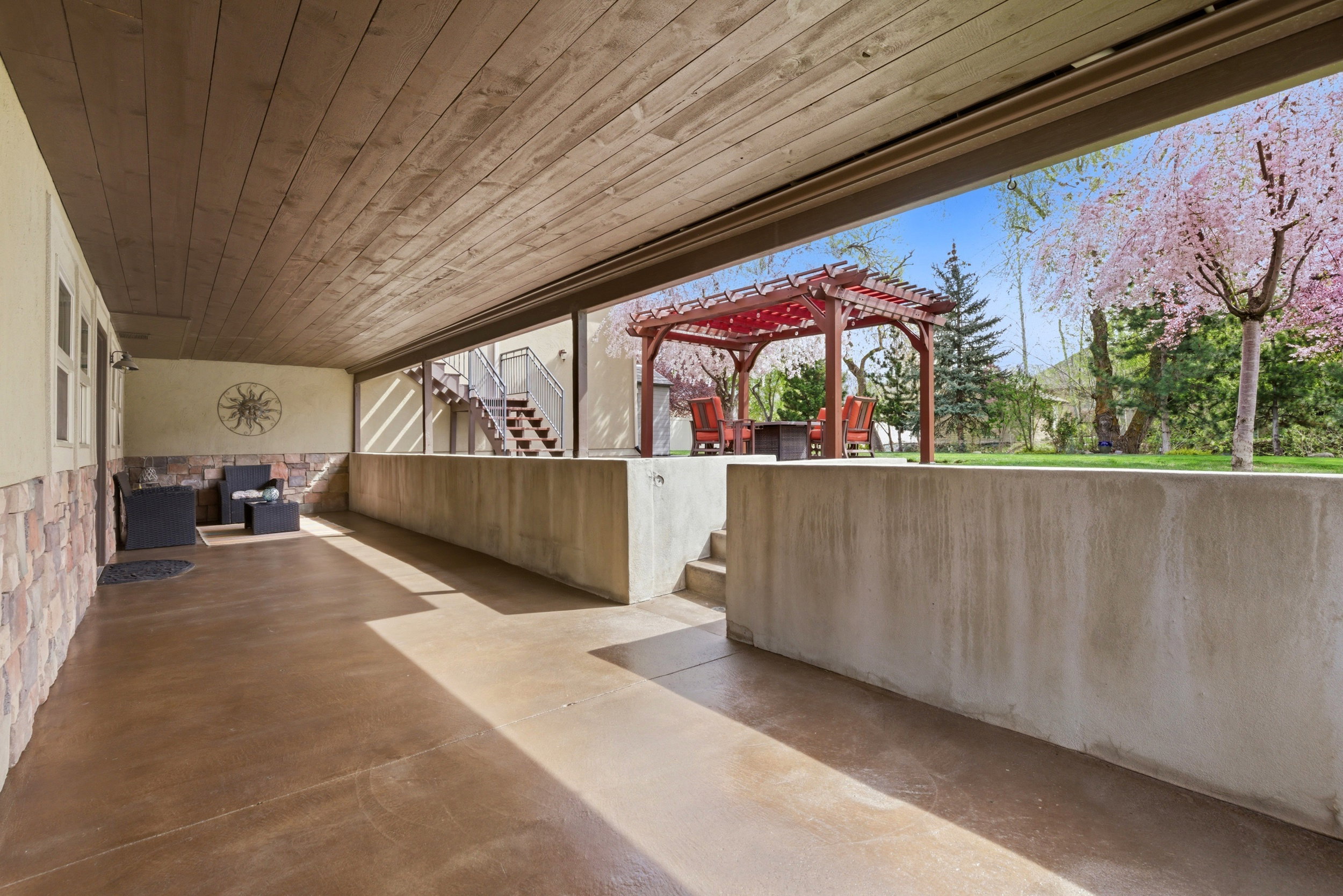 View of patio with stairway and a pergola