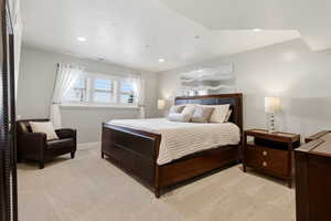 Bedroom featuring light colored carpet and recessed lighting