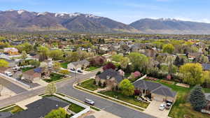 Aerial perspective of suburban area featuring a mountain backdrop