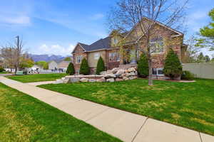 Traditional-style home with stone siding and a mountain view