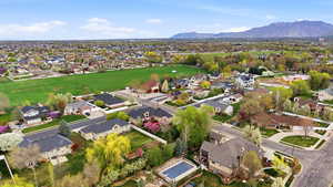 Aerial view of residential area featuring a mountain backdrop
