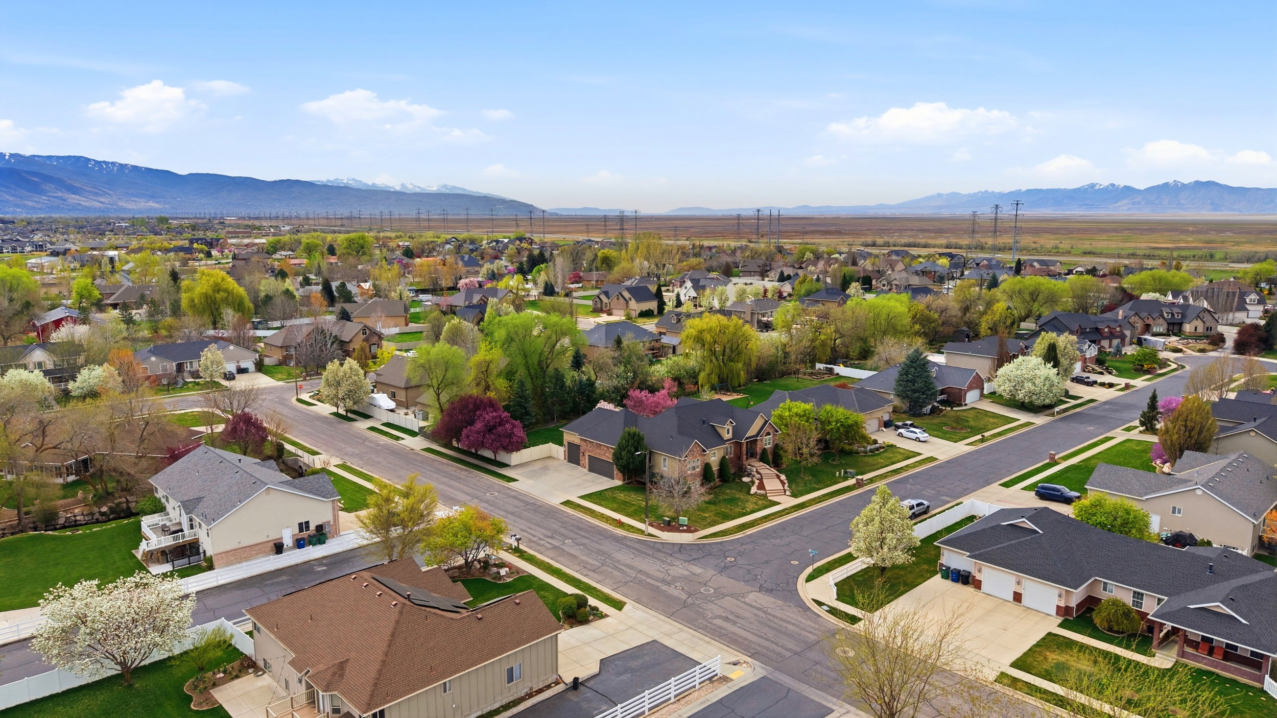 Aerial view of residential area featuring mountains