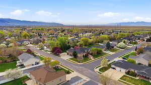 Aerial view of residential area featuring mountains